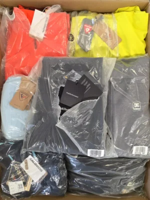 The photo shows a package with footwear in the category AS.