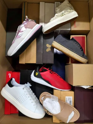 The photo shows a package with footwear in the category AS.