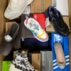 The photo shows a package with footwear in the category AS.