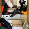 The photo shows a package with footwear in the category AS.