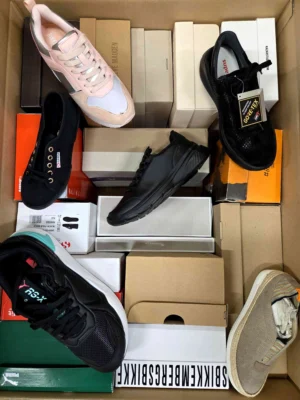 The photo shows a package with footwear in the category AS.
