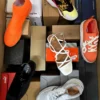 The photo shows a package with footwear in the category AS.