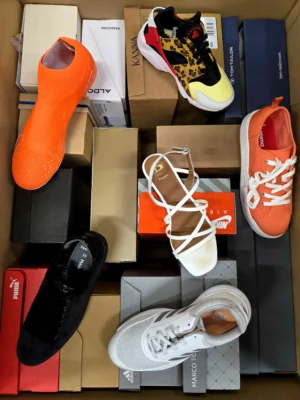 The photo shows a package with footwear in the category AS.