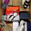 The photo shows a package with footwear in the category AS.