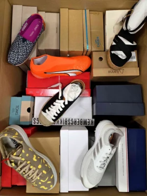 The photo shows a package with footwear in the category AS.
