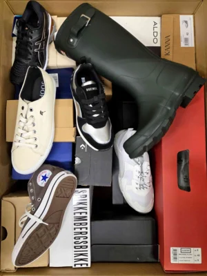 The photo shows a package with footwear in the category AS.