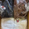 The photo shows a package with clothing in the category B.