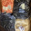 The photo shows a package with clothing in the category B.