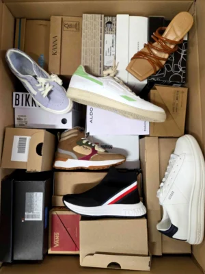 The photo shows a package with footwear in the category AS.