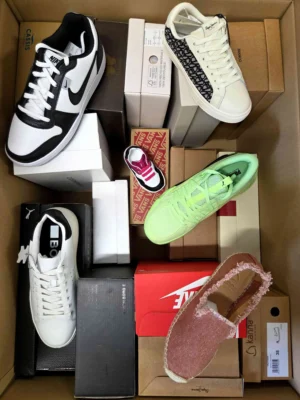 The photo shows a package with footwear in the category AS.
