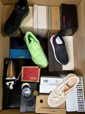 The photo shows a package with footwear in the category AS.