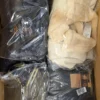 The photo shows a package with clothing in the category B.