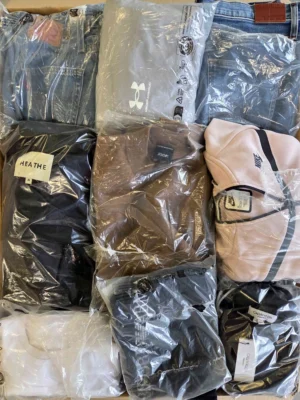 The photo shows a package with clothing in the category D.
