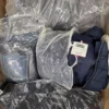 CJ158 2 The photo shows a package with clothing in the category C.