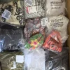 The photo shows a package with clothing in the category B.