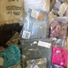 The photo shows a package with clothing in the category B.