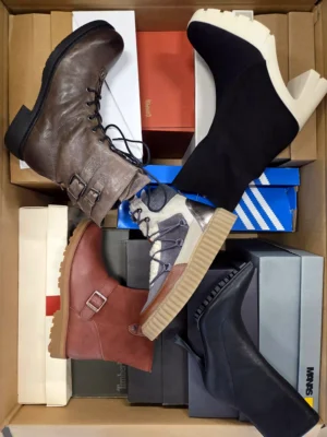 The photo shows a package with footwear in the category AS.