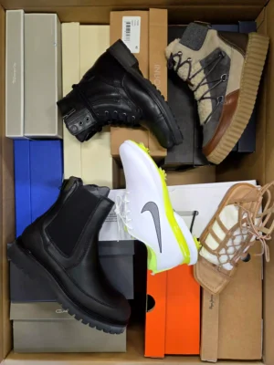 The photo shows a package with footwear in the category AS.