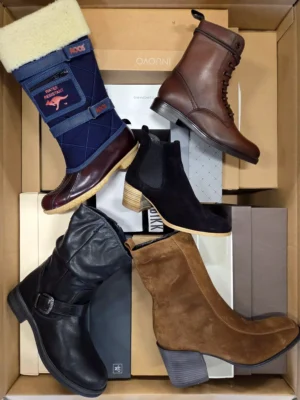 The photo shows a package with footwear in the category AS.