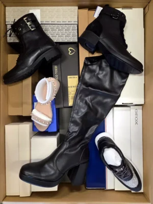 The photo shows a package with footwear in the category AS.