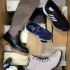 The photo shows a package with footwear in the category AS.