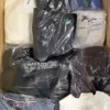 The photo shows a package with clothing in the category B.