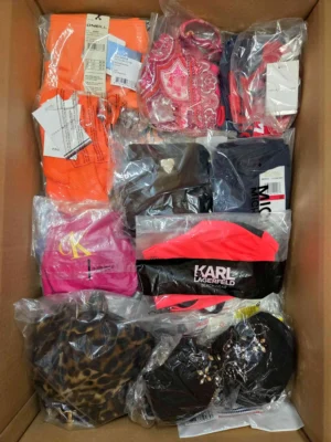 The photo shows a package with clothing in the category ABW.