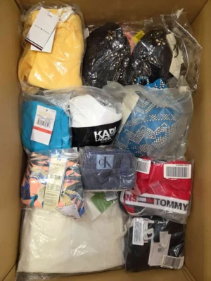 The photo shows a package with clothing in the category ABW.