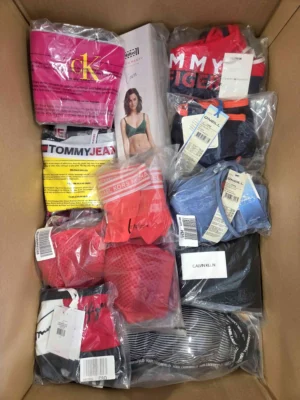 The photo shows a package with clothing in the category ABW.