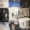 The photo shows a package with clothing in the category T.
