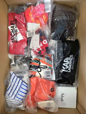 The photo shows a package with clothing in the category ABW.