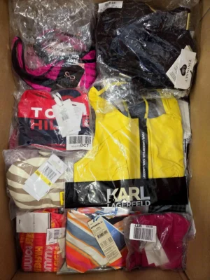 The photo shows a package with clothing in the category ABW.
