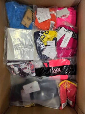 The photo shows a package with clothing in the category ABW.