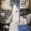 The photo shows a package with clothing in the category T.