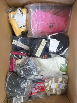 The photo shows a package with clothing in the category ABW.