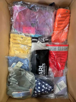 The photo shows a package with clothing in the category ABW.