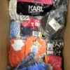 The photo shows a package with clothing in the category ABW.