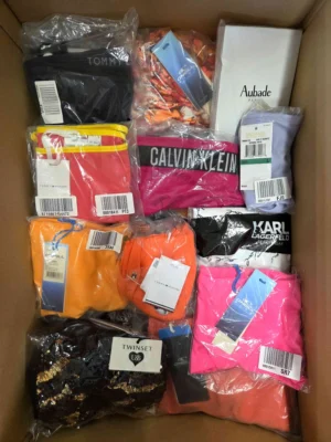 The photo shows a package with clothing in the category ABW.