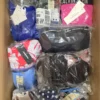 The photo shows a package with clothing in the category ABW.