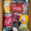 The photo shows a package with clothing in the category ABW.