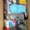 The photo shows a package with clothing in the category ABW.