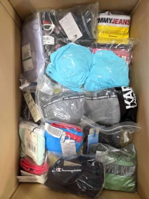 The photo shows a package with clothing in the category ABW.