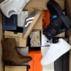 The photo shows a package with footwear in the category BS.