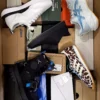 The photo shows a package with footwear in the category BS.