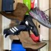 The photo shows a package with footwear in the category BS.
