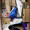 The photo shows a package with footwear in the category BS.