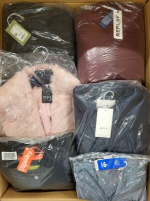 The photo shows a package with clothing in the category AJS.