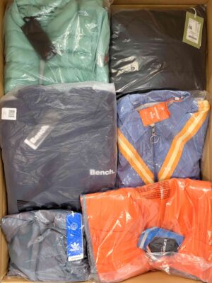 The photo shows a package with clothing in the category AJS.