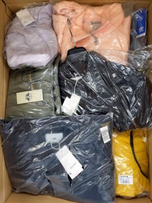 The photo shows a package with clothing in the category AJS.
