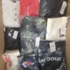 The photo shows a package with clothing in the category AM.